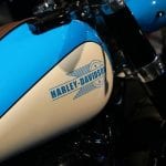 A blue Harley-Davidson logo on the Chopper style customized bike