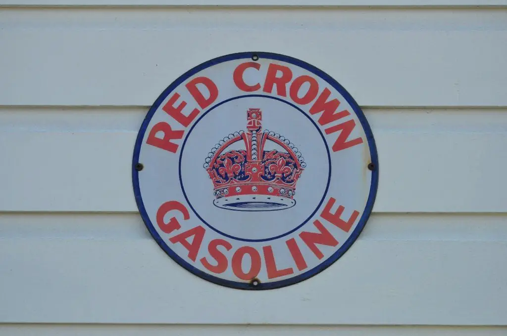 A blue oval with a red and blue crown at the center that reads Red Crown Gasoline